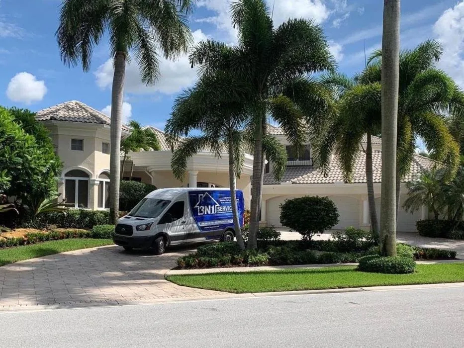 3N1 Services van parked in front of a two-story beige home with palm trees and manicured landscaping.